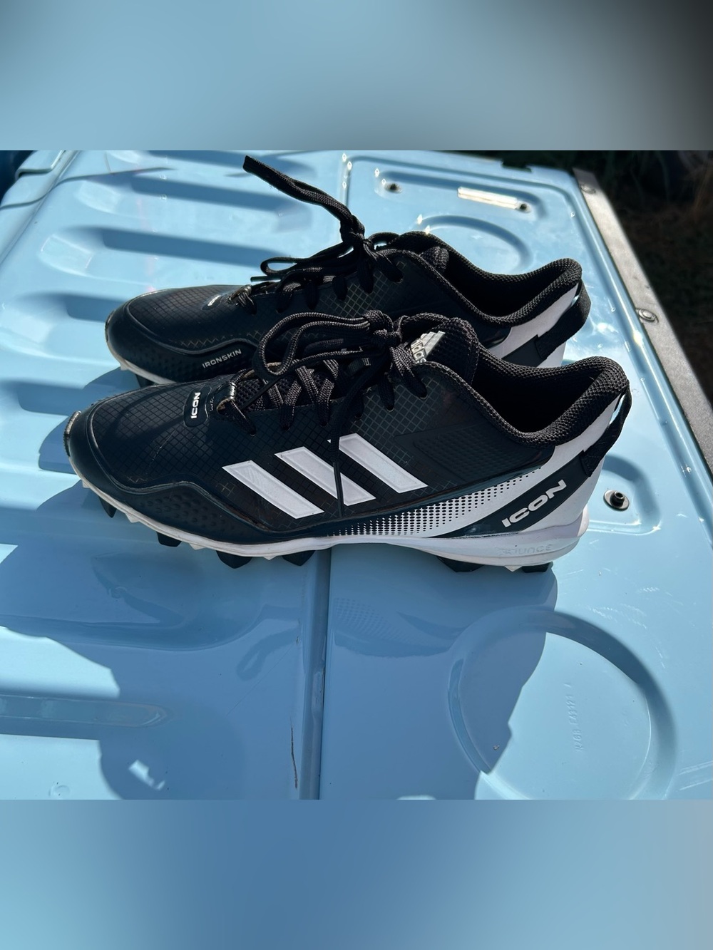 adidas Men’s Black and White ICON Athletic Cleats